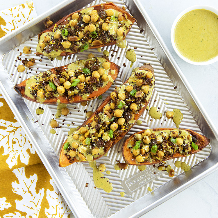 Quinoa and Chickpea Stuffed Sweet Potatoes with a Curry Peanut Sauce