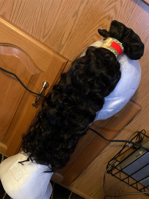 Unleash your style with our luxurious #1 Black Human Hair Extensions. Available at a bargain basement clearance price, this 20-inch jerry curl weft is your ticket to a transformed look.