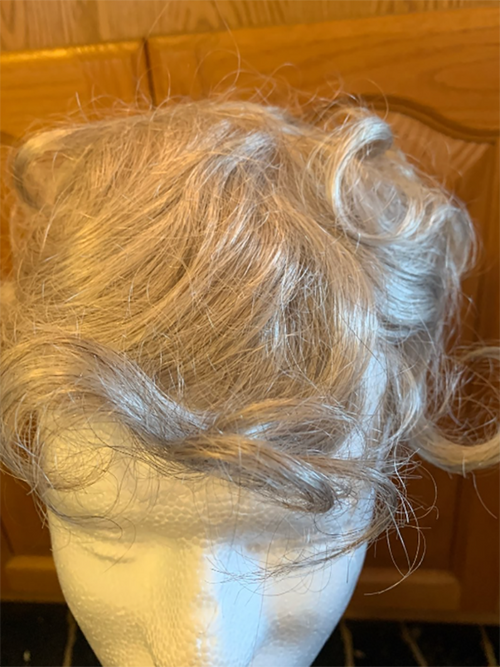 Discover unparalleled luxury and realism with our Small Handmade Gender-Neutral Hairpiece. Featuring 90% synthetic grey and 10% dark brown hair, fine mono interior, and a 3/4-inch clear poly perimeter. Limited clearance sale!