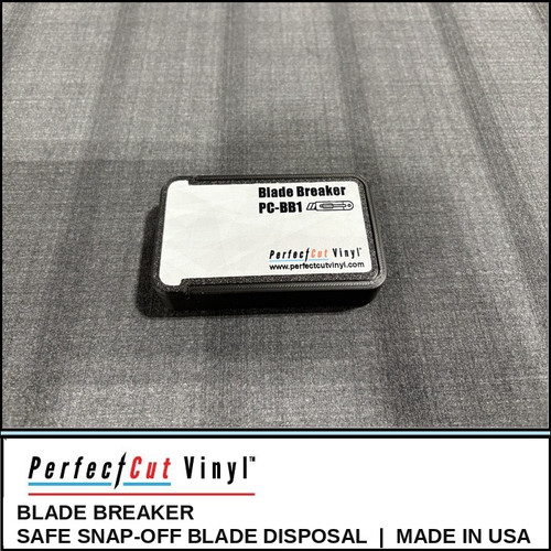 PerfectCut Vinyl Blade Breaker, a compact black snap-off blade disposal case with a magnetic lid, on a gray shop mat