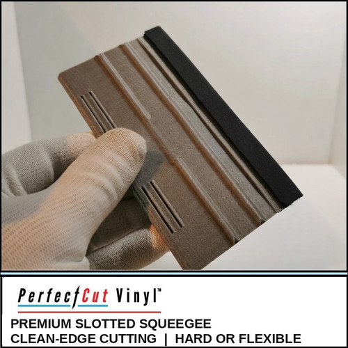 Gloved hand holding the PerfectCut Vinyl Premium Slotted Squeegee, available in hard or flexible, showing the integrated cutting slits and felt edge