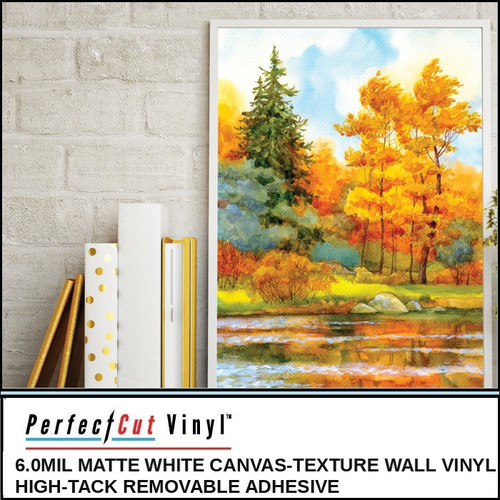PerfectCut Vinyl 6.0mil matte white canvas-texture wall vinyl with high-tack removable adhesive, shown as a vibrant watercolor autumn forest landscape print displayed in a white frame against a brick wall.