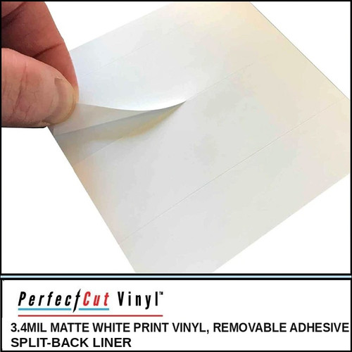 PerfectCut Vinyl 3.4mil matte white print vinyl with removable adhesive and split-back liner, shown as a hand peeling back the corner of a cut sheet to reveal the split liner.