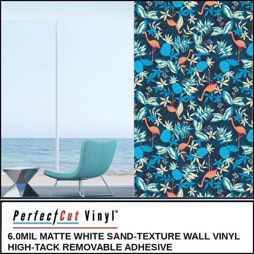 PerfectCut Vinyl 6.0mil matte white sand-texture wall vinyl with high-tack removable adhesive, shown as a navy tropical flamingo and foliage wallpaper mural beside a teal lounge chair with an ocean view.