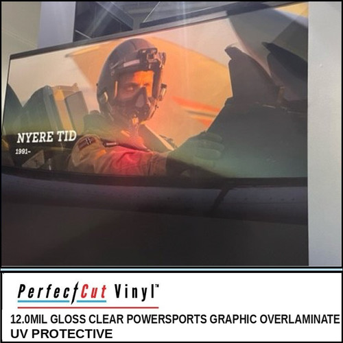 PerfectCut Vinyl 12.0mil gloss clear UV-protective powersports graphic overlaminate, shown protecting a large printed wall graphic of a fighter-jet pilot in a cockpit.
