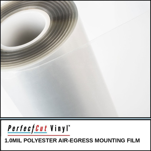 PerfectCut Vinyl 1.0mil polyester air-egress mounting film, shown as a partially unrolled clear film roll on a white surface.
