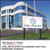 PerfectCut Vinyl 3.4mil matte white calendered print vinyl with permanent adhesive, shown as a "Global Connections" corporate logo on a freestanding outdoor monument sign in front of a modern office building.