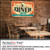 PerfectCut Vinyl 3.5mil matte white opaque rough-surface wall vinyl with high-tack removable adhesive, shown as a vintage "Eat Here! Diner" graphic applied to an exposed brick wall in a cafe.