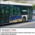 PerfectCut Vinyl 3.5mil matte white opaque transit advertising vinyl with removable adhesive, shown as a "City Walk" skyline ad panel on the side of a white city bus in motion.