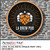 PerfectCut Vinyl 3.0mil gloss white opaque print vinyl with air-egress adhesive, shown as a round black and orange "LA Brew Pub" hop-leaf logo sign mounted on a stone wall.
