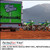 PerfectCut Vinyl 2.4mil gloss white vehicle wrap vinyl with repositionable air-egress adhesive, shown as a green box truck wrap parked on a dirt lot beside two motocross bikes with mountains behind.