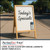 PerfectCut Vinyl 2.0mil gloss clear dry-erase laminate for short-term P.O.P. use, shown on a wooden A-frame sidewalk sign with handwritten "Today's Specials" and two dry-erase markers.
