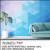 Living room with a geometric blue-and-purple triangle wall mural printed on PerfectCut Vinyl 6.0mil Matte White Wall Graphic Vinyl, beside a teal couch and potted plant