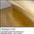 Close-up of PerfectCut Vinyl Gold Metalized Polyester Film in a brushed finish showing the fine directional grain