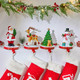 Minetom Christmas Stocking Holders for Mantle Set of 4, 3D Resin Tree Reindeer Snowman and Santa Claus Stocking Hangers, Home Xmas Decorations for Fireplace Mantel Table Garland