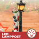 VP Home Christmas Snowman Decor Christmas Figurines Resin Snowman Lighted Decorations Indoor Glowing Lamppost Trio Wreath LED Holiday Light Up Snowman Indoor Festive Fiber Optic Decorations