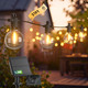 Kawaya Solar-Powered String Lights Outside: 31 FT Outdoor LED Patio Lights with USB-Charging, IP65 Waterproof 15 Shatterproof Edison Bulbs Bistro Lights for Yard Porch Deck Cafe