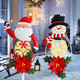 Solar Christmas Garden Stakes 2 Packs Santa and Snowman Christmas Metal Yard Stakes with LED Lights Waterproof Xmas Outdoor Decorations for Garden Lawn Pathway