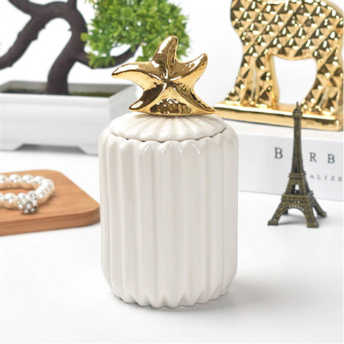 Modern Ceramic Jar
This white ceramic jar with golden accent is perfect for keeping your makeup organised in the bathroom, living room decoration, or any other space.