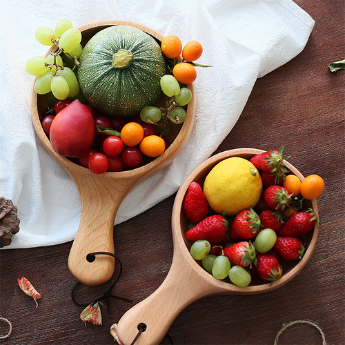 Diameter 15cm Wooden Bowl with Handle - Serving Tray - Fruit and Vegetable Tray. This beautiful wooden bowl is perfect for serving fruit, and vegetables or as a decorative tray. It has a stylish design and comes in light wood or dark wood. The diameter is 15 cm.