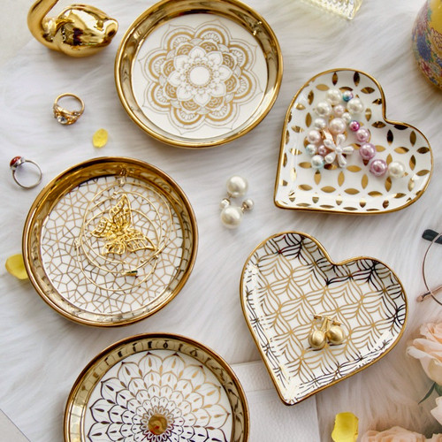 Porcelain Decorative Plate - Display Plate | Ruby and Lola Home Decor
Add a touch of spark to your home decor with the Porcelain Decorative Plate from Ruby and Lola Home Decor. Crafted from porcelain, this plate comes in round or heart shape and features delicate golden design patterns. Perfect for displaying jewellery, trinkets or candles! Shop now and get free shipping.