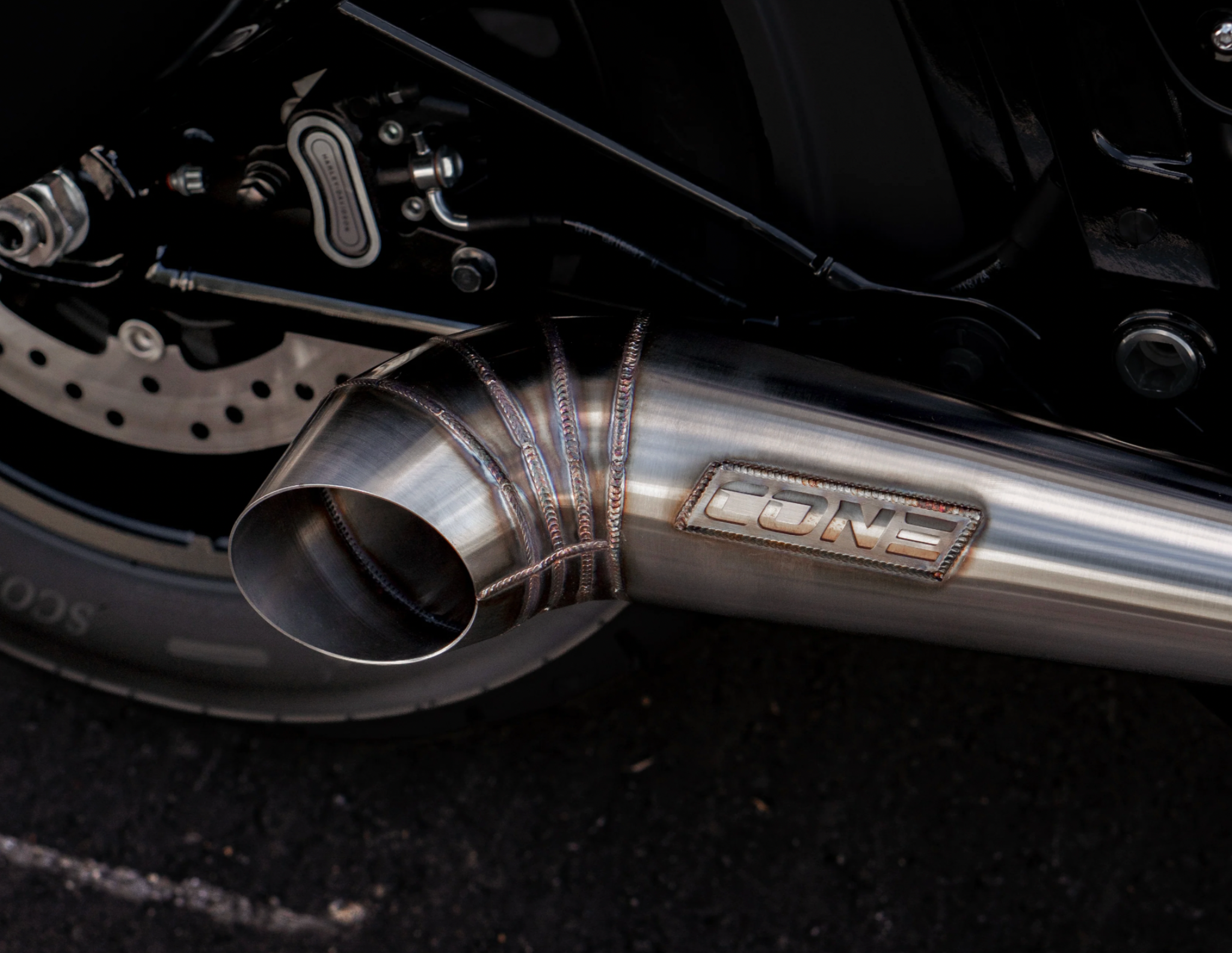 Close up of Cone Performance exhaust outlet and Cone badge