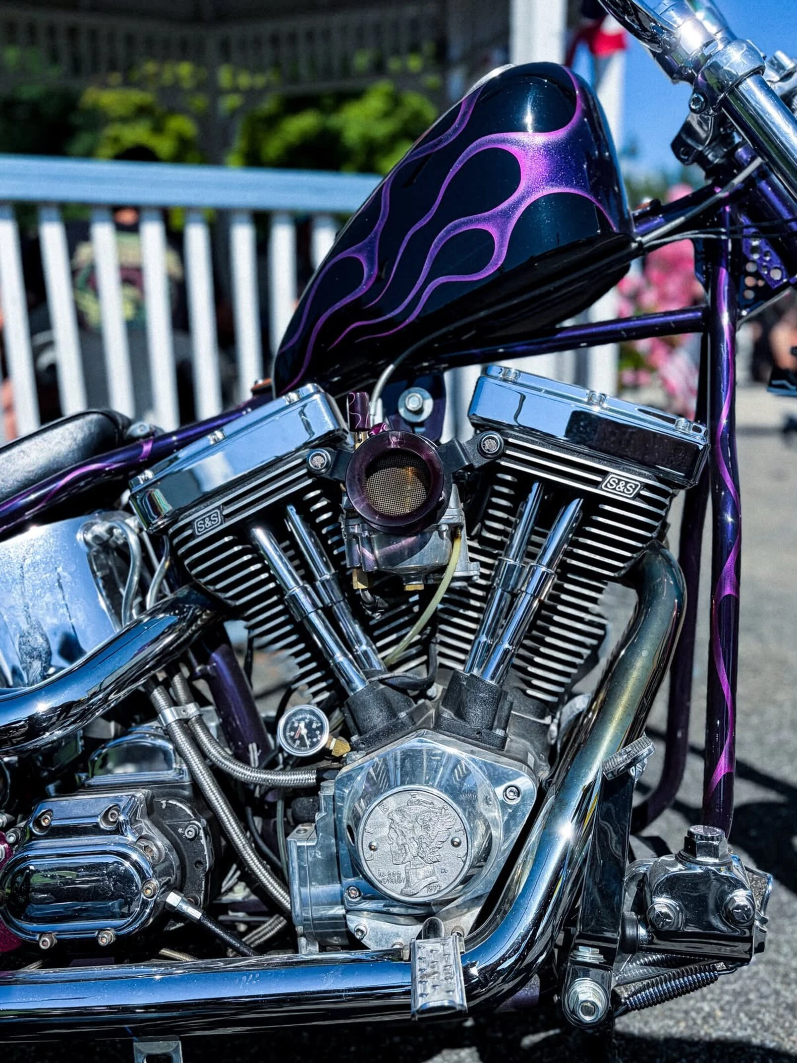 Purple flamed tank over a polished V-twin at DBR 2026