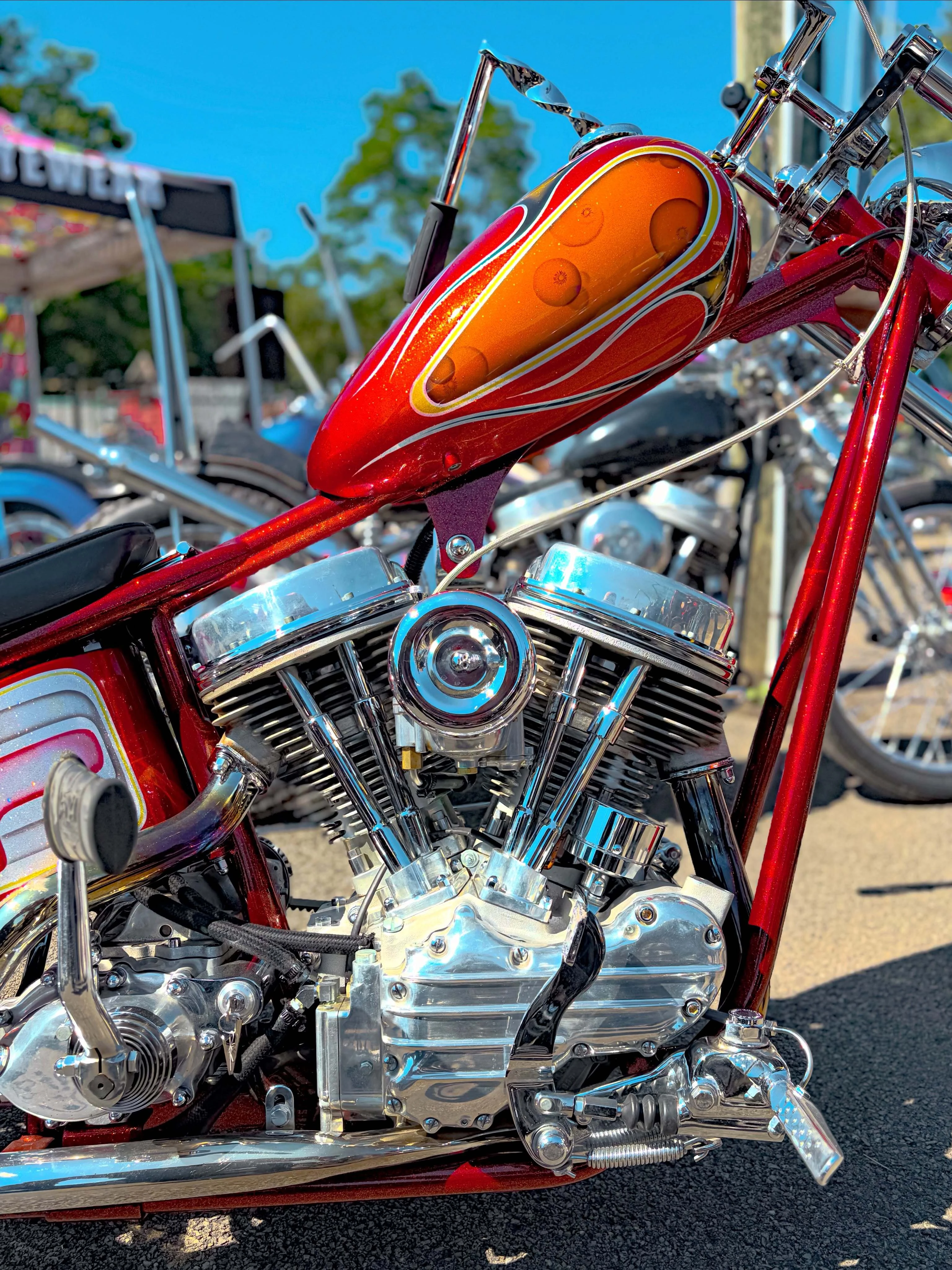 Candy red chopper with a polished Panhead motor at DBR 2026