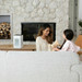 White Air Purifier on a table top in the living with a mother and young daughter playing together.