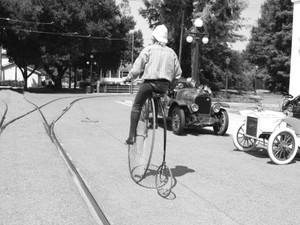Modern man riding a penny-farthing (b/w version)