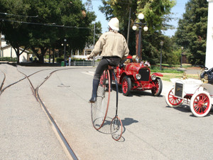 Modern man riding a penny-farthing (color version)