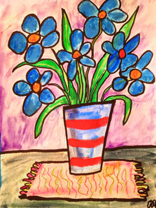 Blue flowers in a stripy vase
