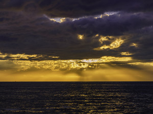 Golden And Purple Sunset with Clouds in Ocean Beach, San Diego