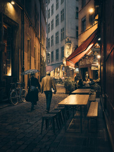 Lovers walking at night in the streets of Lyon in France