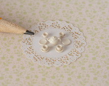 Make quarter scale, 1:48 dollhouse china with these plastic dish blanks