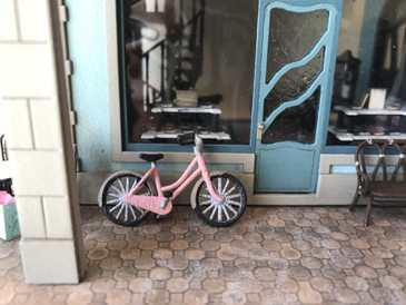 The bicycle is shown in front of Joie de Vivre Bookshop.