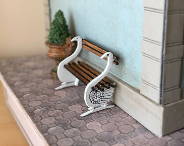 1:48 quarter scale swan bench kit shown on the exterior of Joie de Vivre Bookshop.