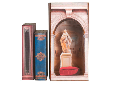 A tiny art museum hidden within a miniature book nook
