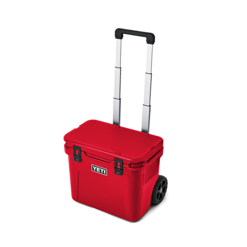 YETI Roadie 32 Wheeled Cooler - Rescue Red Angle With Handle