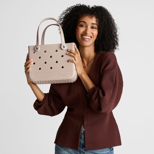 Woman holding bitty bogg bag