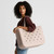 Model holding an Original Bogg Bag