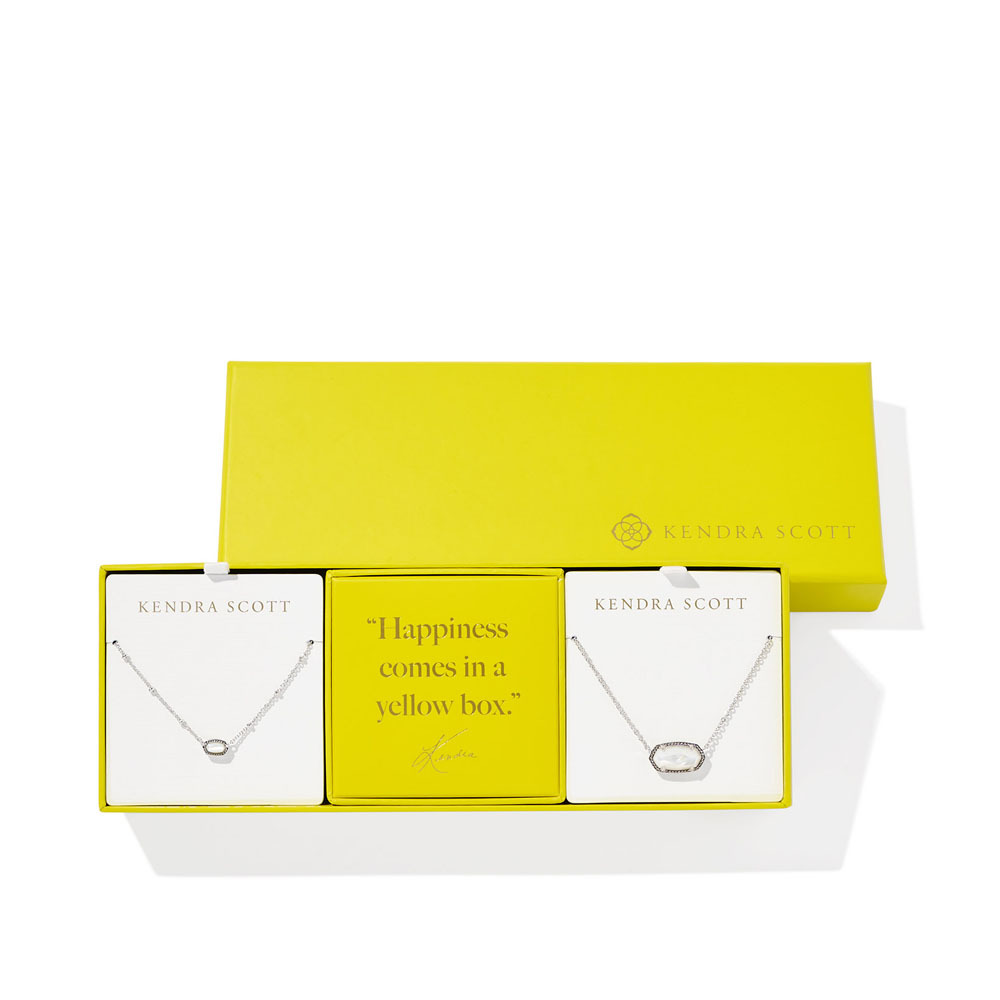 Kendra Scott jewelry in yellow gift box