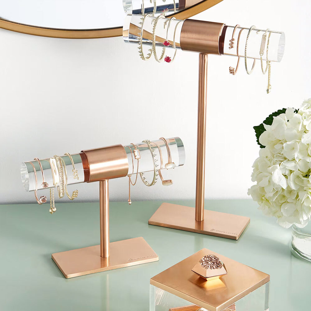 Kendra Scott jewelry hanging on fixtures