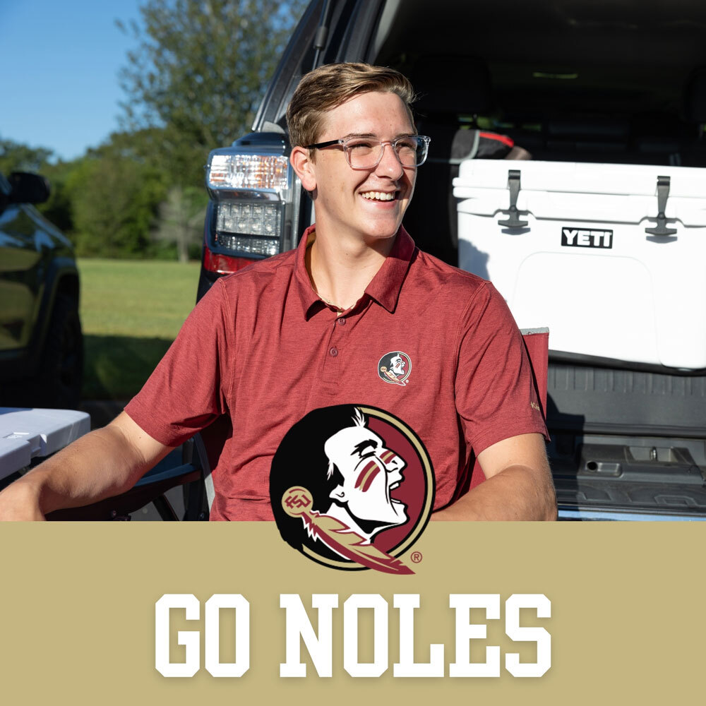 Florida State University Southern Collegiate Apparel. Two male students holding Yeti cooler tailgating wearing Florida State University red shirts.