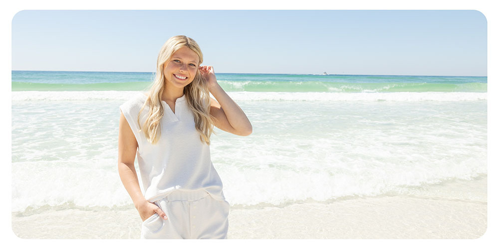 A woman wearing a matching set while on the beach