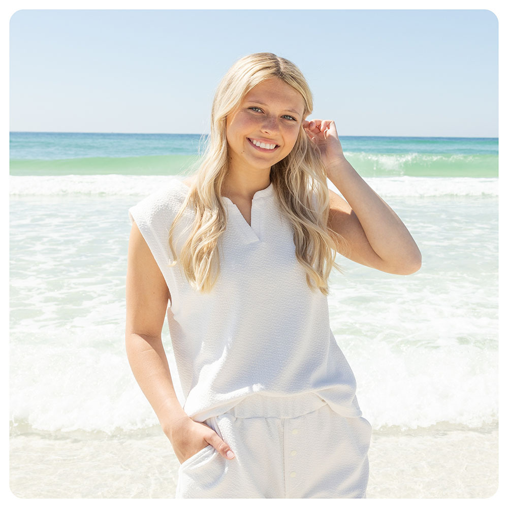 A woman wearing a matching set while on the beach