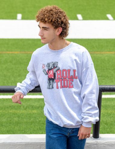 Man leaning on railing in Alabama Roll Tide Sweatshirt