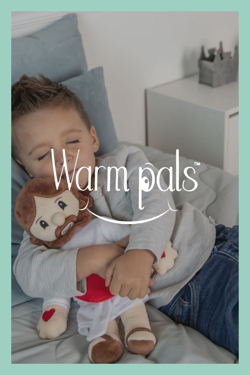 Warm Pals logo over image of child sleeping holding a Jesus plush