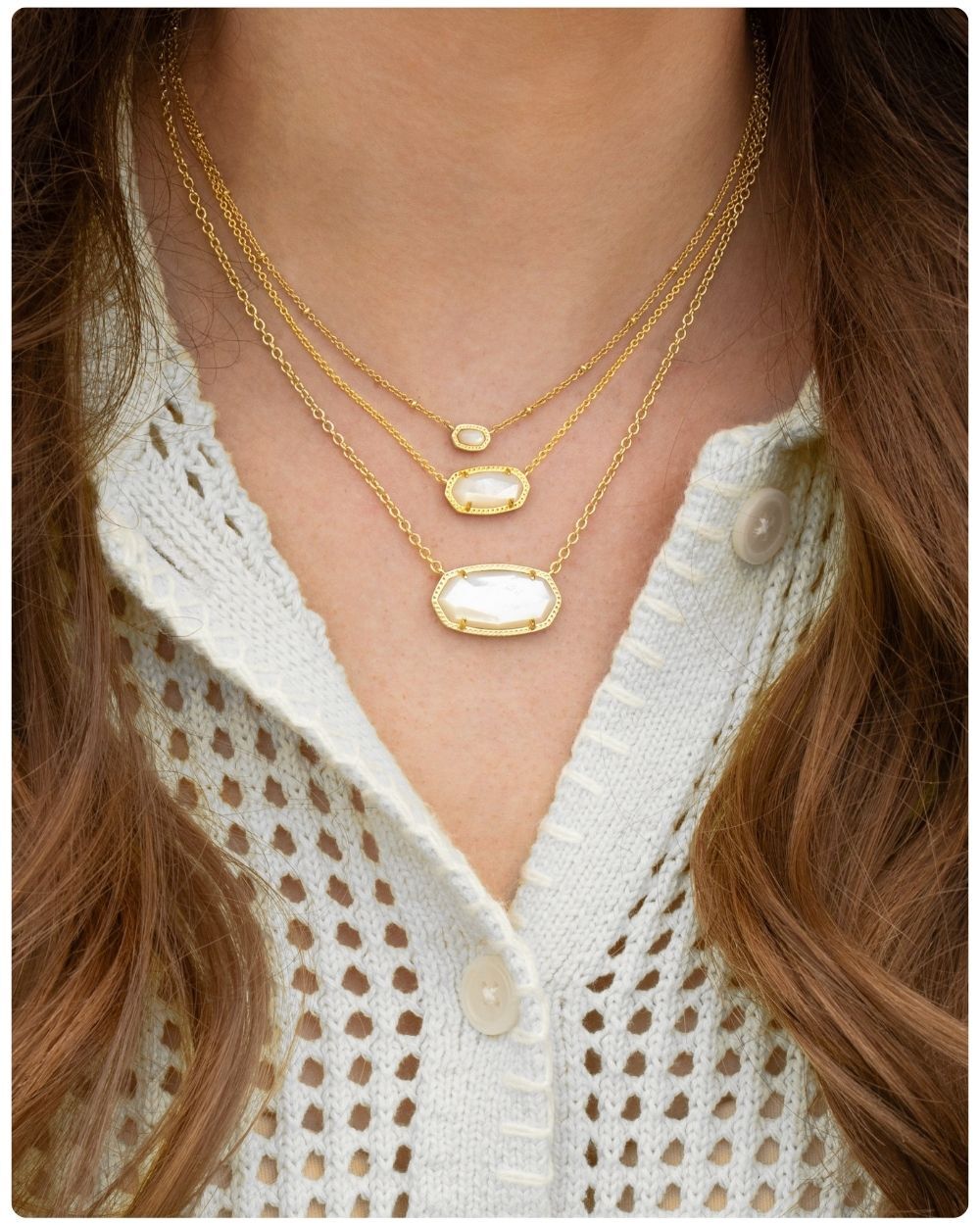 Woman wearing Kendra Scott necklaces
