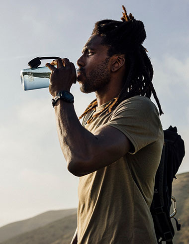 Man drinking out of a water bottle